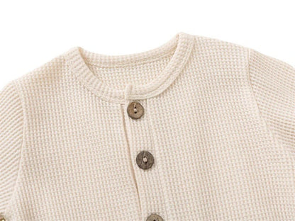 Combinaison pour bébé avec boutons en bois et poche